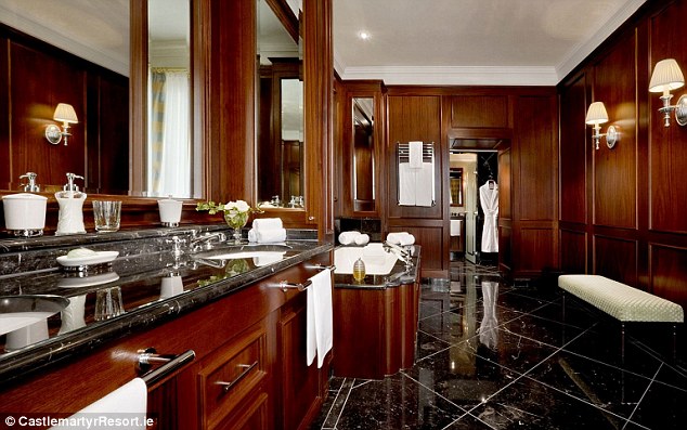 Spacious design: The five-star hotel suite boasts a stunning bathroom with a bath and walk-in shower
