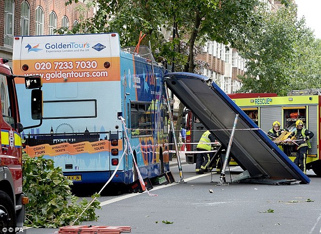 This image shows how the roof of the bus was left completely detached by the impact 
