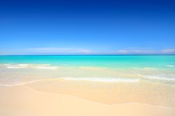 A photograph of Grace Bay Beach, Turks and Caicos Islands