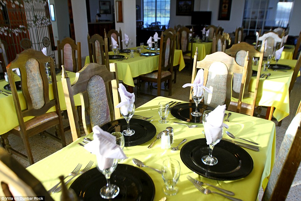 Come dine with them: The island pad's amenities stretch to an indoor gym and a large dining room