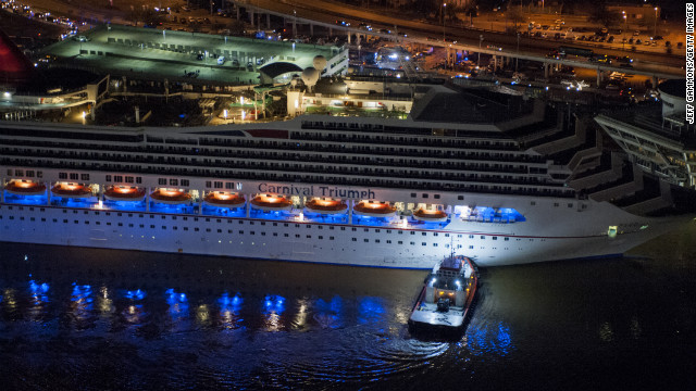 The crippled cruise liner Carnival Triumph limps into port late Thursday, February 14, in Mobile, Alabama. Passengers had endured five days aboard the stricken ship with little power and few toilet facilities after a fire knocked out propulsion and other systems on Sunday, February 10. 