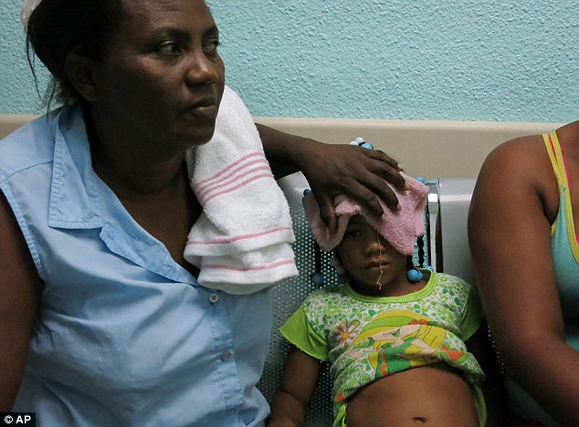 Suffering: Five-year-old Karla Sepulveda displays symptoms of chikungunya fever symptoms in the Dominican Republic