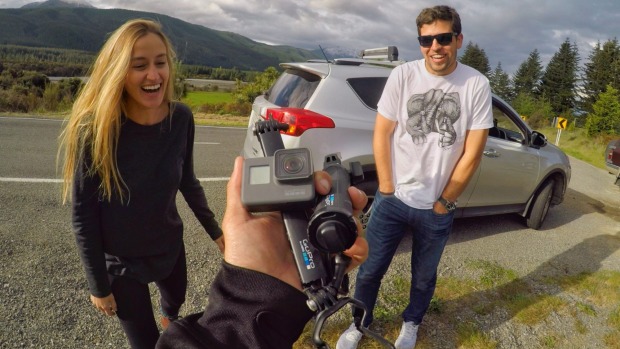 Kyle Mulinder takes a photo of the camera he saved from the road and returns it to owners and travelers who thought they ...