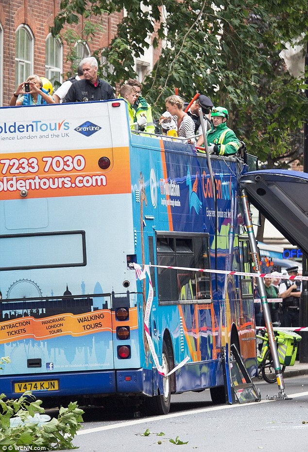 Passengers could be seen on the top desk of the bus, tending to each other and being cared for by paramedics