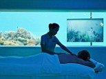 True relaxation: Enjoy a spa treatment as you gaze at the world of art and fish beyond the windows