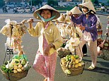 Women carry goods to market in Ho Chi Minh City