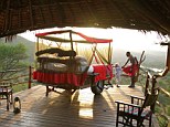 Morning, sun! A lodge guide and a young guest admire the view from the outdoor bedroom at the unusual outdoor resort of Loisaba