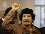 Dictator: Former Libyan leader Col. Muammar Gaddafi gestures as he enters the U.N. headquarters in 2009 for the United Nations General Assembly