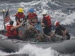 Safety: Rescuers plucked Eric and Charlotte Kaufman and their daughters, Cora, 3, and Lyra, 1, from a sailboat in the Pacific Ocean on Sunday and transferred them to a U.S. Navy frigate that will take them back to California, the U.S Coast Guard said