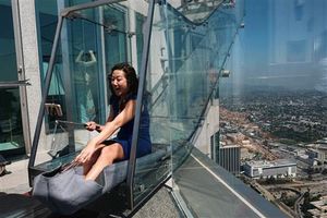 AP reporter's terrifying trip on 1,000-foot-high glass slide