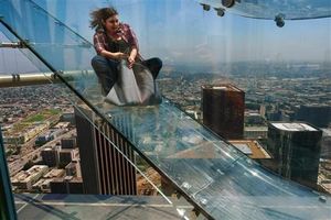 AP reporter's terrifying trip on 1,000-foot-high glass slide