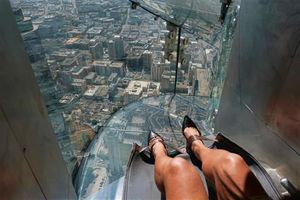 AP reporter's terrifying trip on 1,000-foot-high glass slide