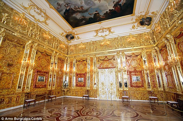 Opulent: Every wall in the Amber Room at Catherine's Palace is lined in the fiery glow of fossilised pine resin