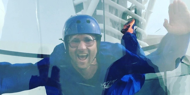 Tristram Clayton tries the skydiving simulator aboard the Anthem of the Seas. Photo / Supplied