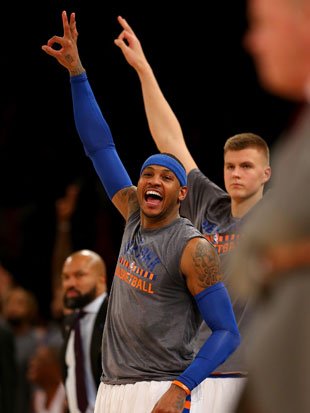 Carmelo Anthony and Kristaps Prozingis cheer away. (Getty Images)