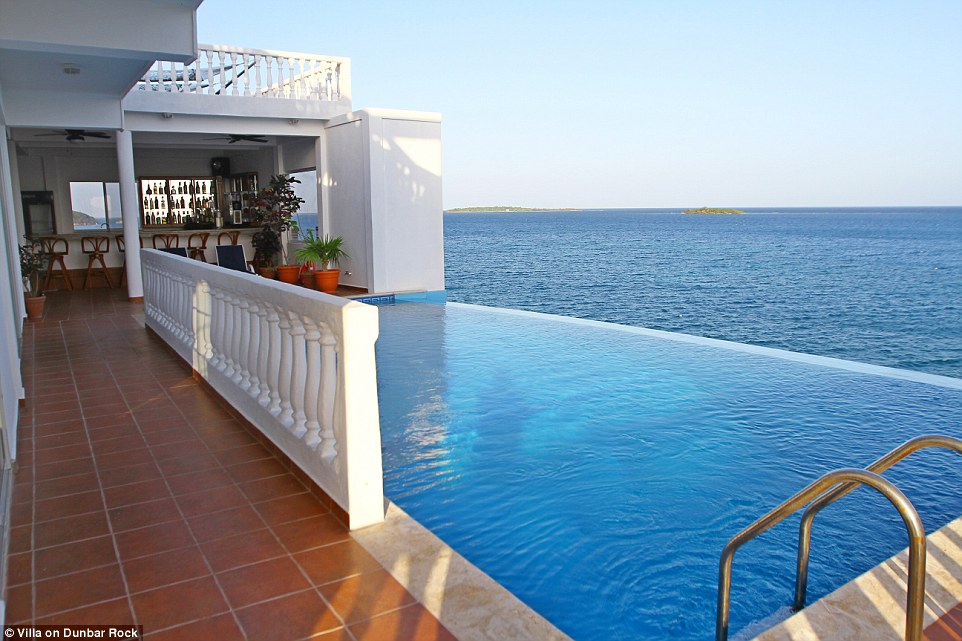 The pool area features a small bar - so guests can sip a cocktail while drinking in the views 