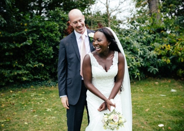 Just married: But Gabrielle Yinka Saunders, pictured during her wedding to David Osborne, stole £17,000 to pay for the ceremony and her luxury honeymoon