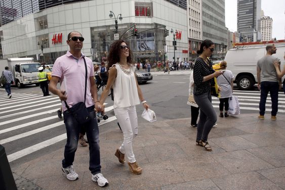 PHOTO: Newlyweds Valasia Limnioti, right, and Konstantinos Patronis walk along 34th Street and 6th Avenue in Midtown Manhattan, Thursday, July 2, 2015, in New York. The couple topped the dream trip of our lives in New York City, where their three-week honeymoon turned into a nightmare: Their Greek-issued credit cards were suddenly declined and they were left nearly penniless. Strangers from two Greek Orthodox churches in Queens came to their rescue, giving them survival cash until their flight home to Greece this Friday. (AP Photo/Mary Altaffer)